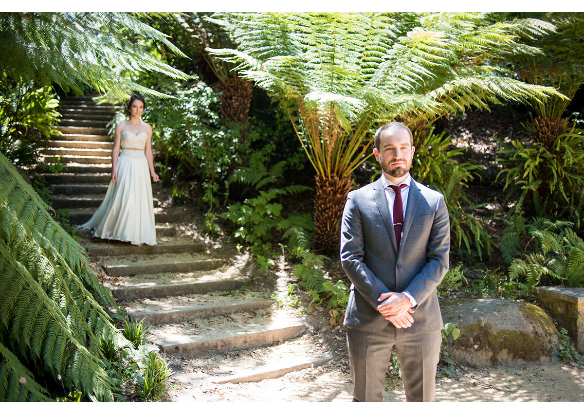 Bride walking down to steps during first look at Golden Gate Park