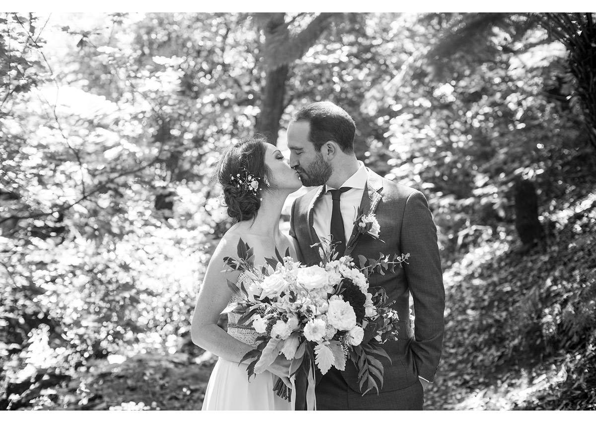 Black and white of bay area bride and Groom kissing