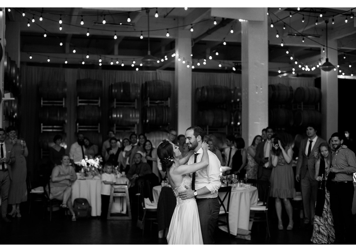 Black and white of bride and groom's first dance at Dogpatch Wineworks