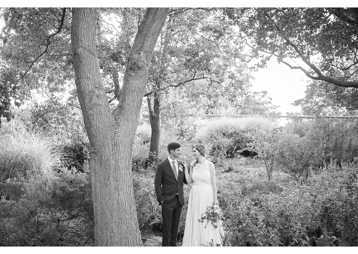Black and white of bride and groom in garden