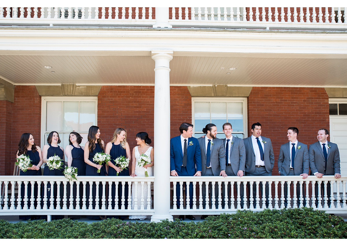 Wedding party on balcony of Inn at the Presidio