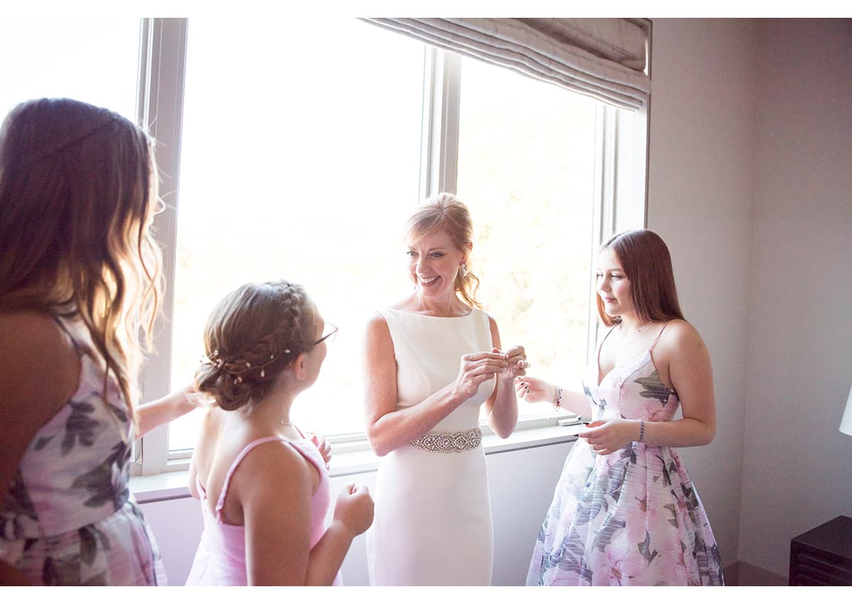 Bride and her daughters getting ready for Sonoma wedding