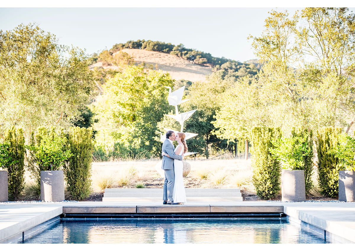 Bride and Groom kiss at the end of pool