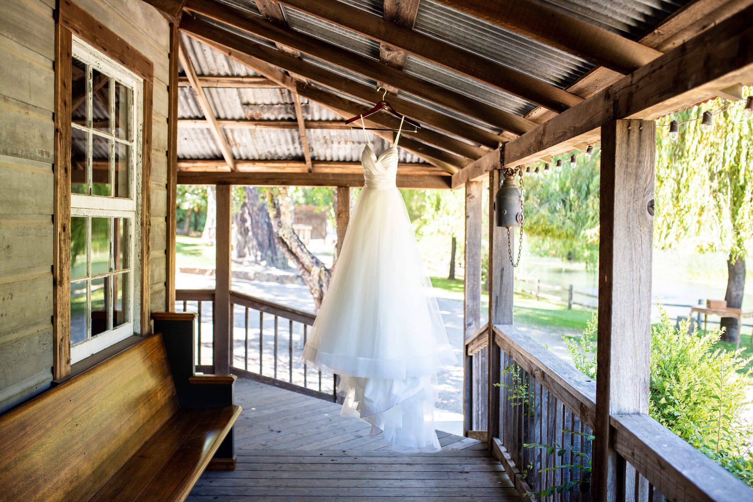 Wedding dress hanging up on porch at Radonich Ranch