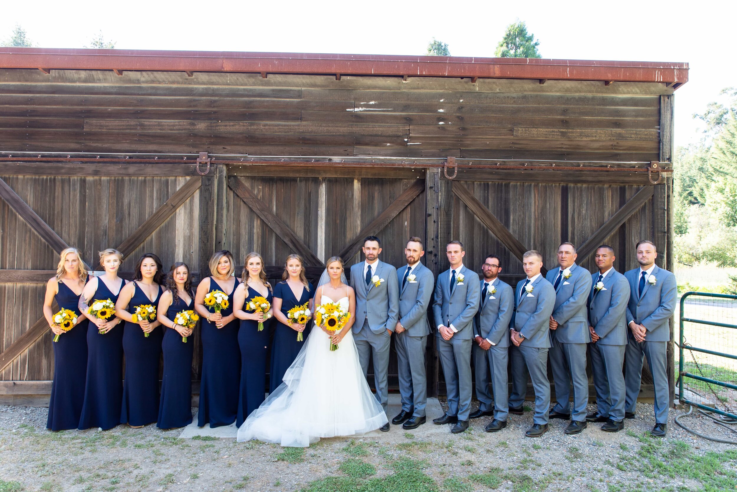 Rustic barn wedding party photo