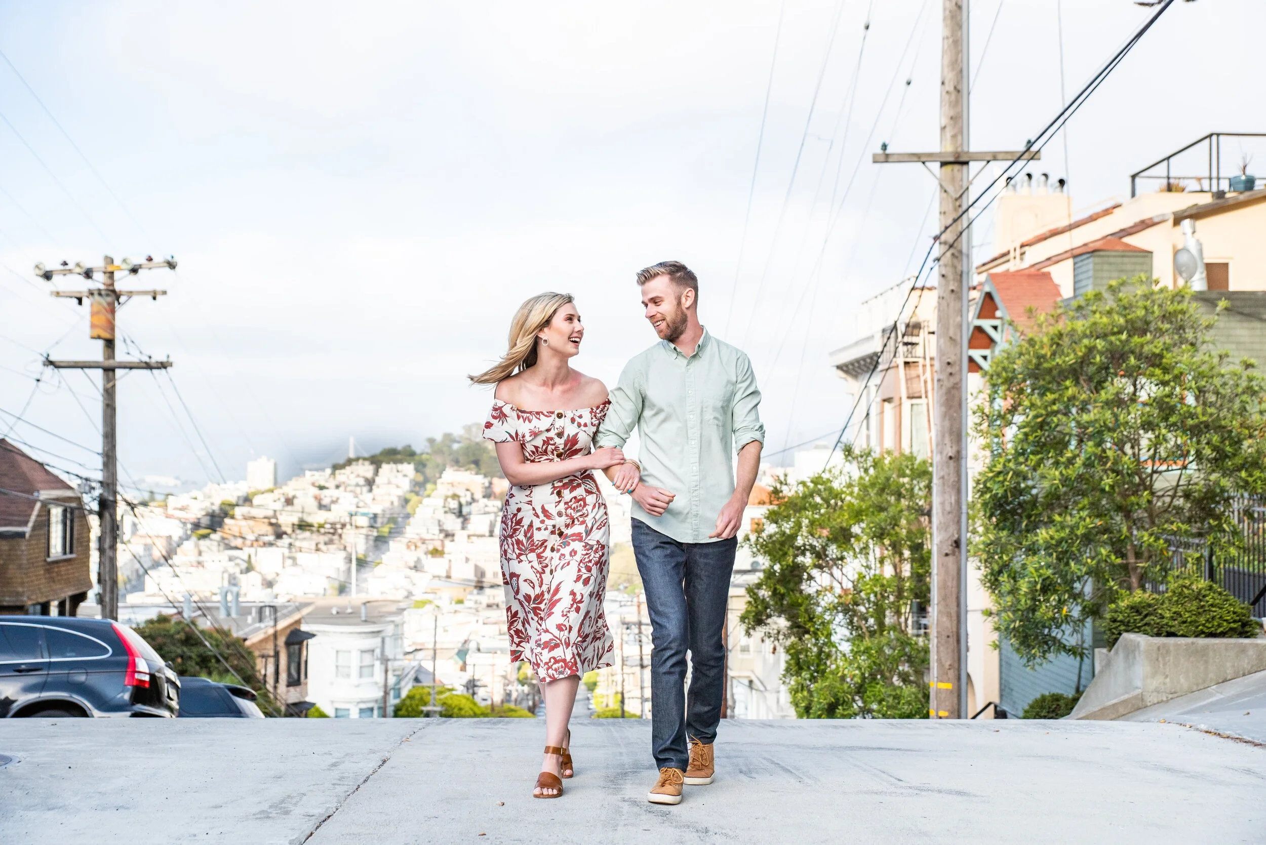 Newly engaged couple walking on Russian Hill in SF