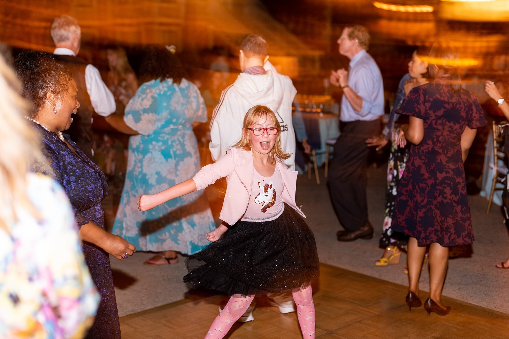 Young wedding guest flossing