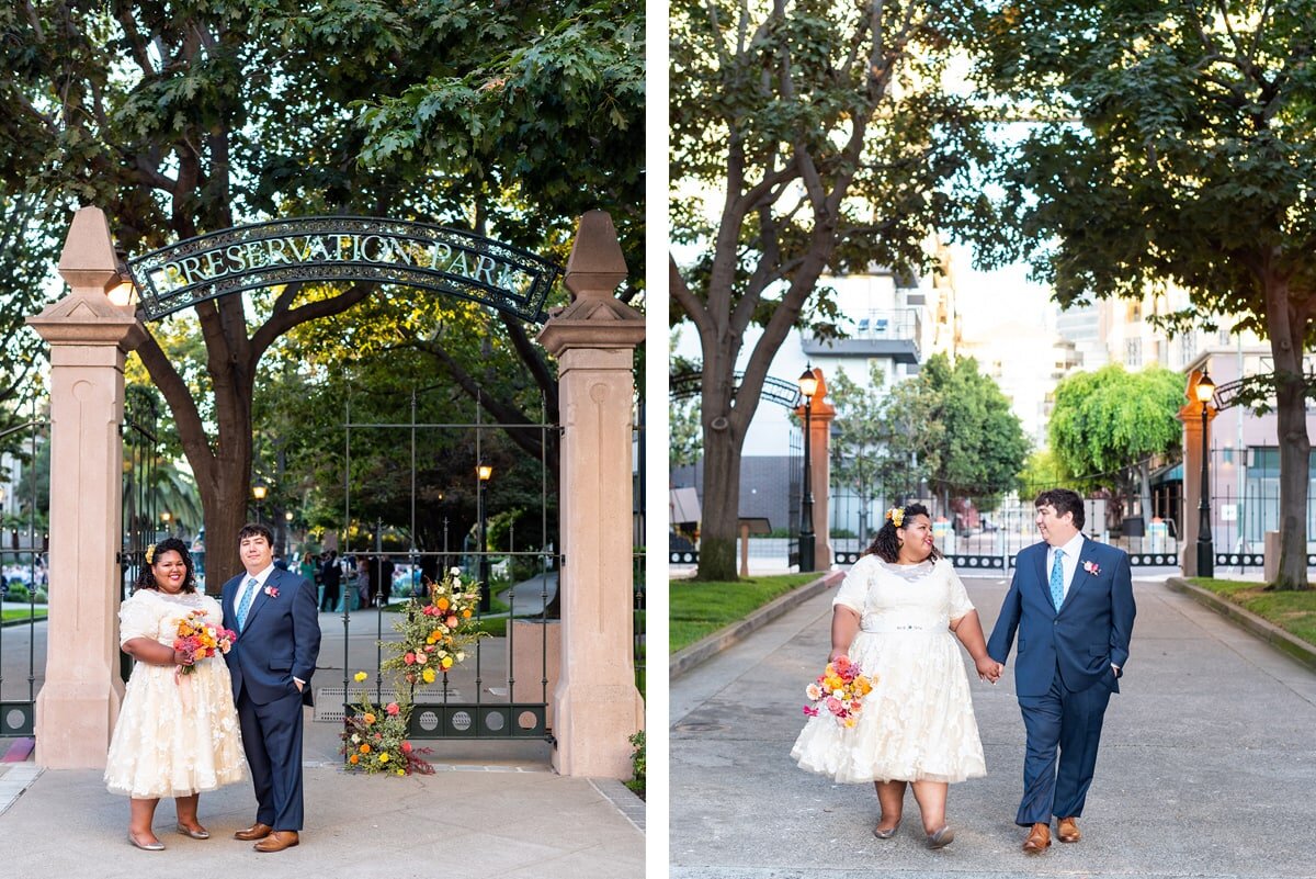 Bride and Groom standing in front of Preservation Park gate in Oakland