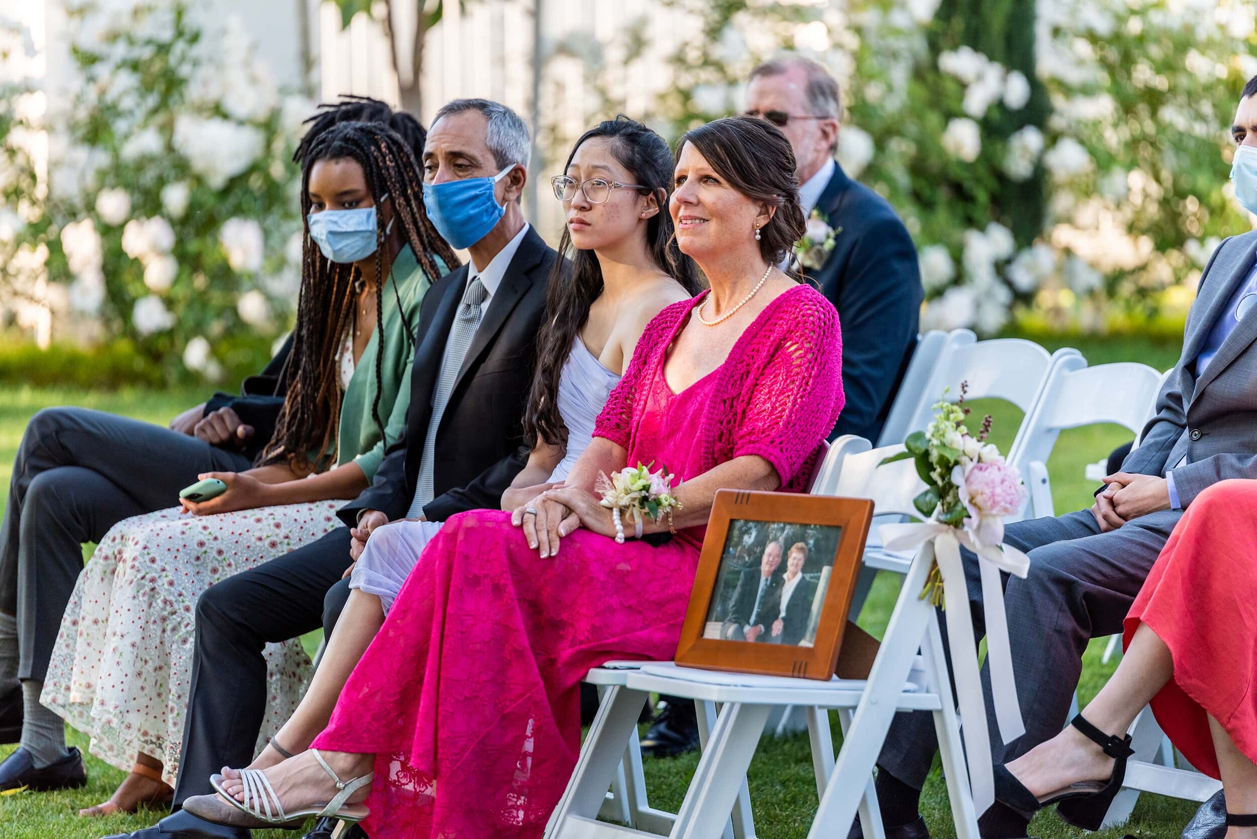 Groom's family during wedding ceremony at San Ramon Waters