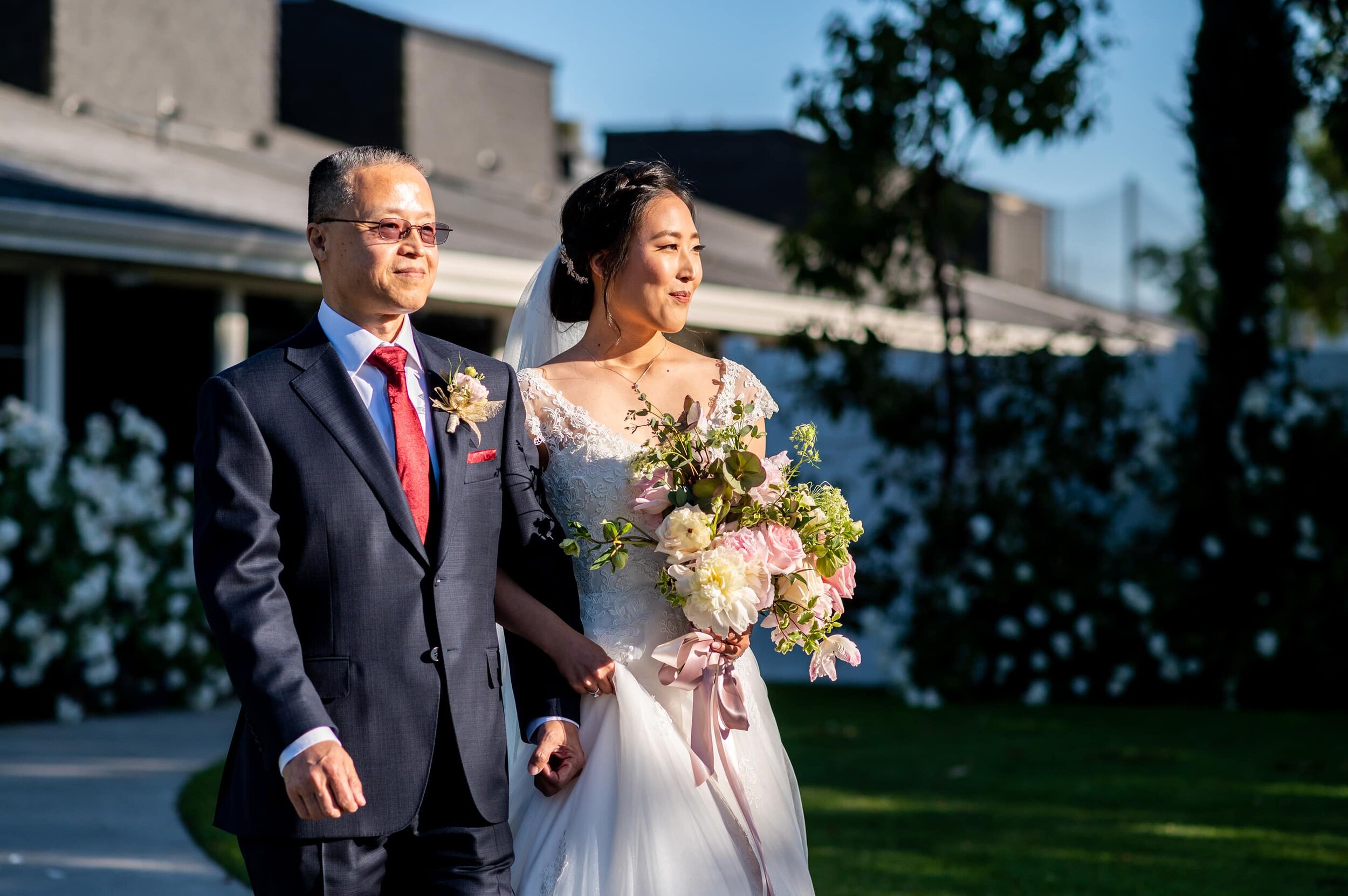 Father walking Bride down aisle during wedding ceremony at San Ramon Waters