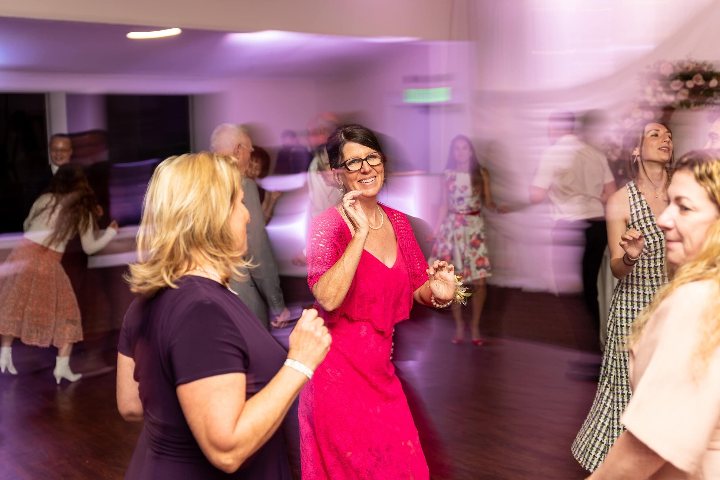 Mother of groom dancing during reception