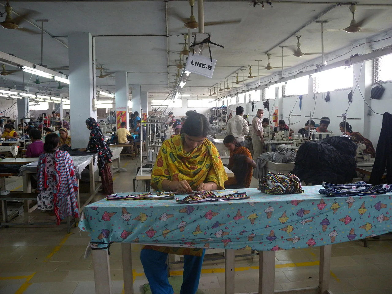 A clothing textile garment factory / assembly line in Bangladesh. Photo by: Tareq Salahuddin