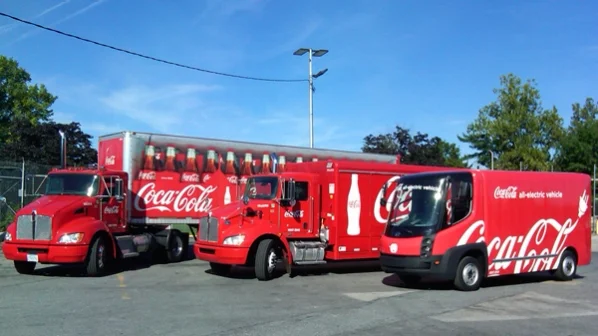 The new fleet of hybrid Coca-Cola delivery trucks, intended to reduce the brand’s carbon footprint. Photo courtesy of the Coca-Cola Company .