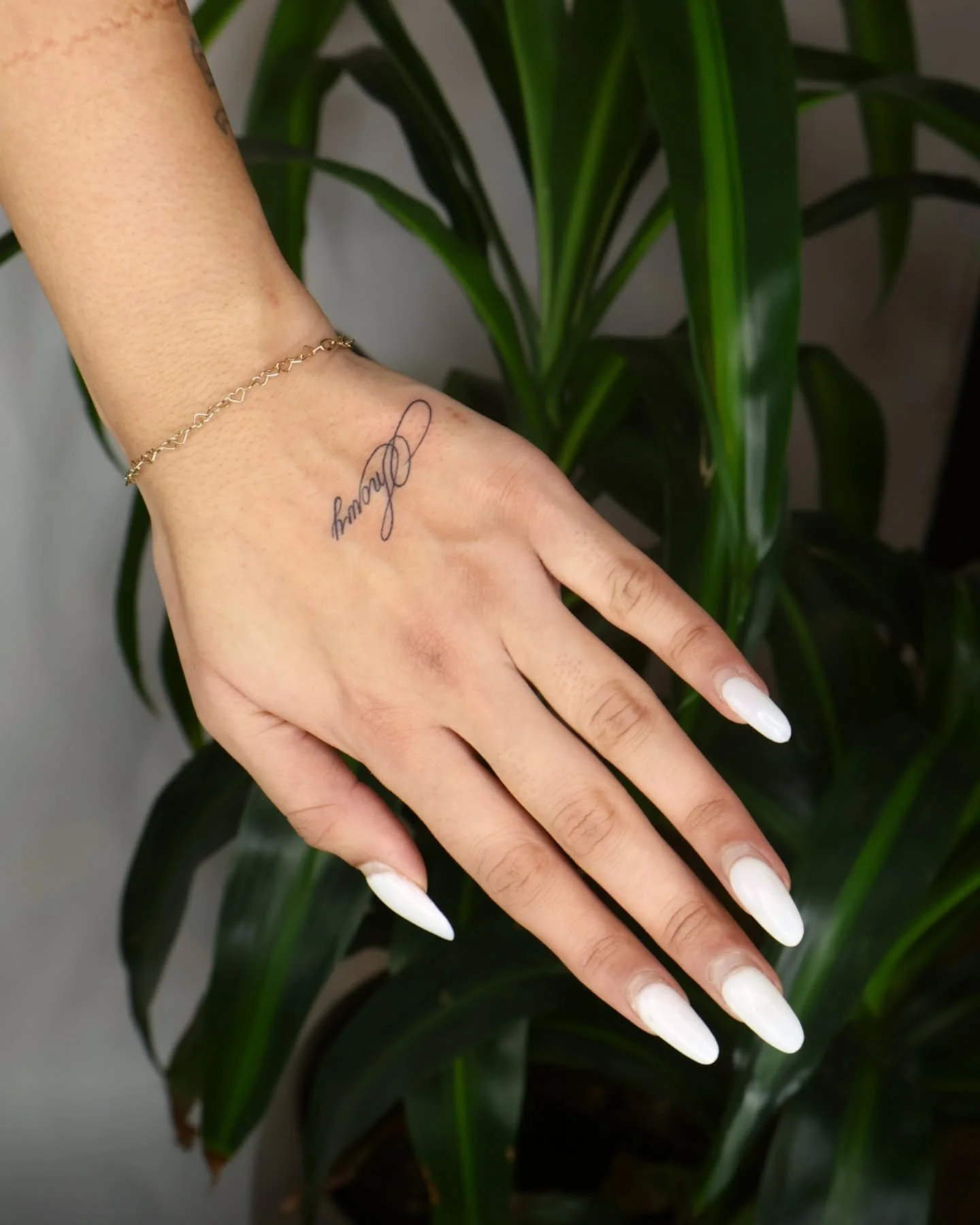 One of my favorite little pieces is this name on an arm for a very special pup, Snowy 🐾 

amazing to see how much meaning a simple design can hold. 

♡ let&rsquo;s create something meaningful together.

#nametattoo