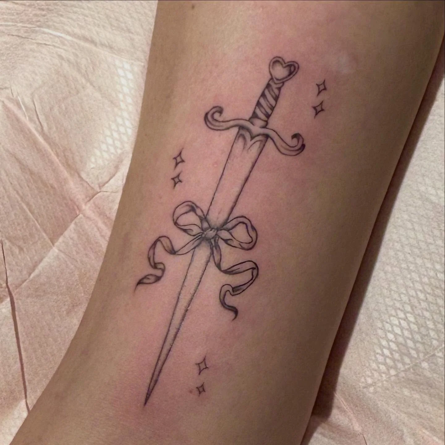 ₊˚ ‿︵‿︵‿︵୨୧ &middot; &middot; ♡ &middot; &middot; ୨୧‿︵‿︵‿︵ ˚₊
Custom sword for Sofia! 

#tattooartistnyc #daggertattoo #finelinetattoo #blackandgreytattoo #tattooinspo #brooklyntattoo #girlytattoos #daintyink #bowtattoo #chappellroan