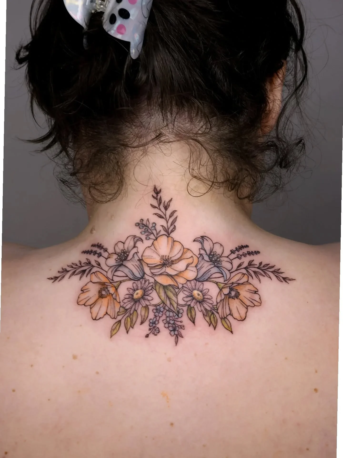 A custom floral neck and back piece for Ashley! We did low saturated colours to give it that vintage faded look. I'm not accepting full color pieces anymore, but for faded color or grayscale florals, definitely DM me!
.
#floraltattoo #botanicaltattoo
