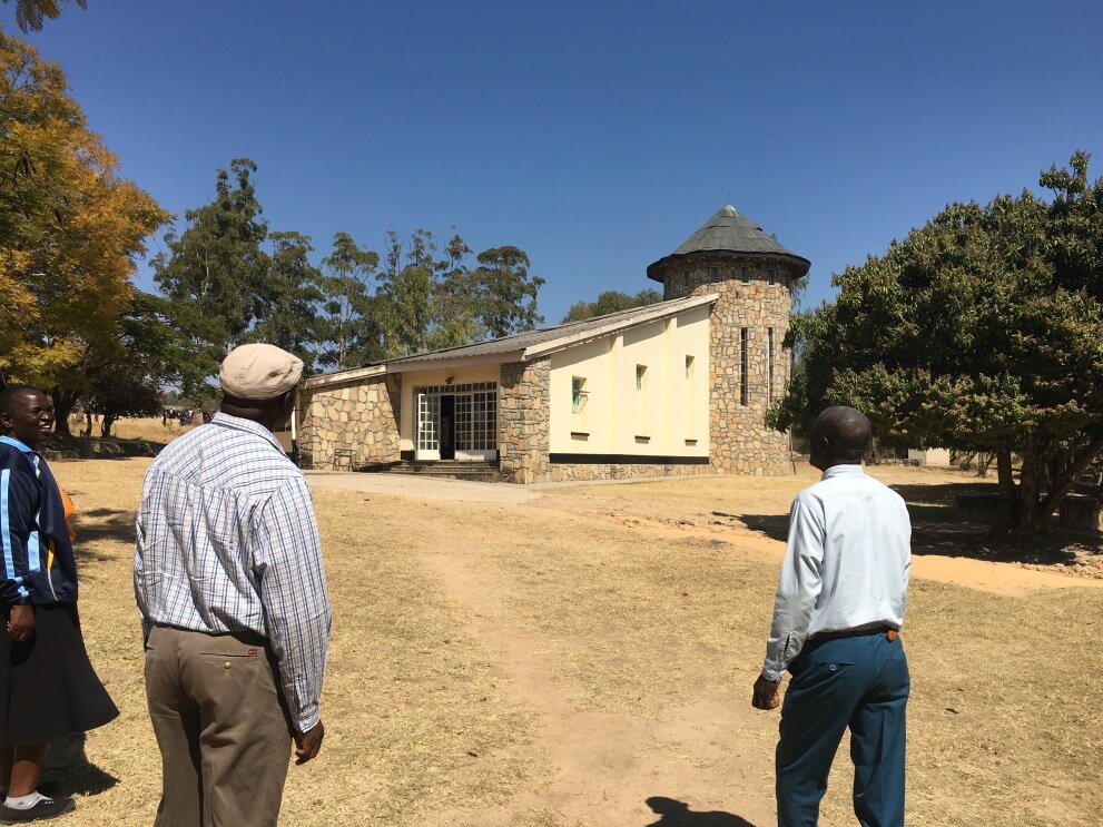  Charles Kaguda, HoH National Director, and Pastor Nyemba visiting the school chapel. 