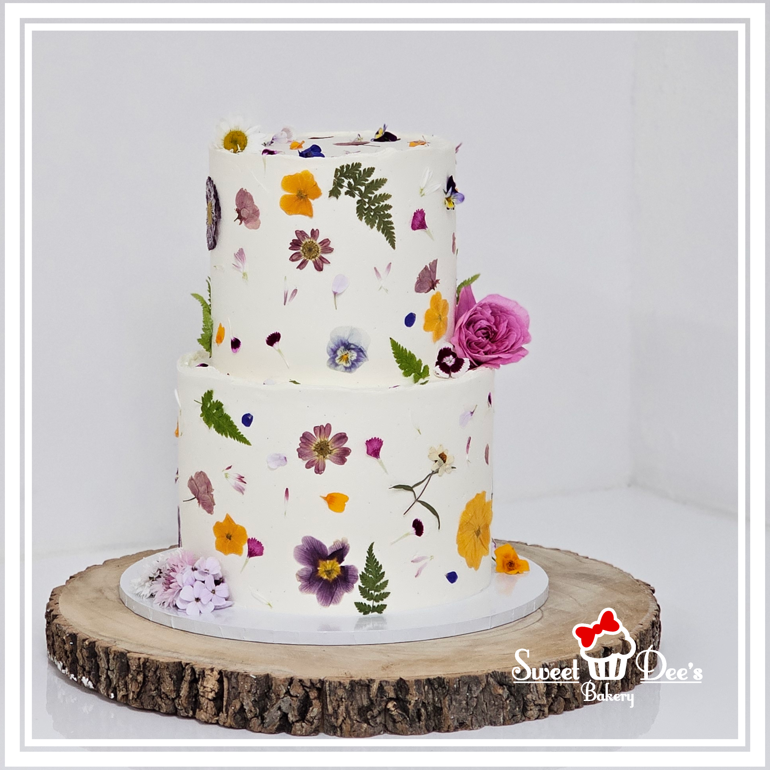 Pressed flower wedding cake with petals
