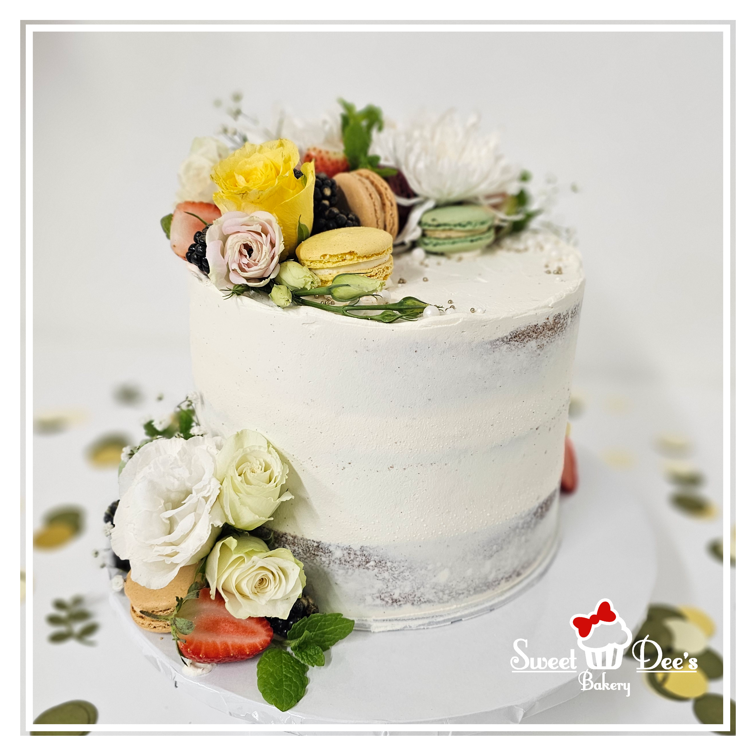 Semi-naked cake with Fresh fruit, Macarons and Flowers