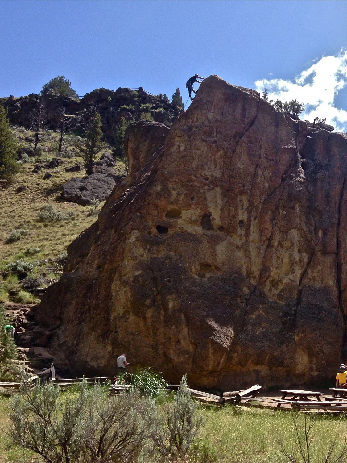 The start of the Rope-de-Dope Trail emerges to the left of the giant climbing rock block that bears its name at Smith Rock State Park.