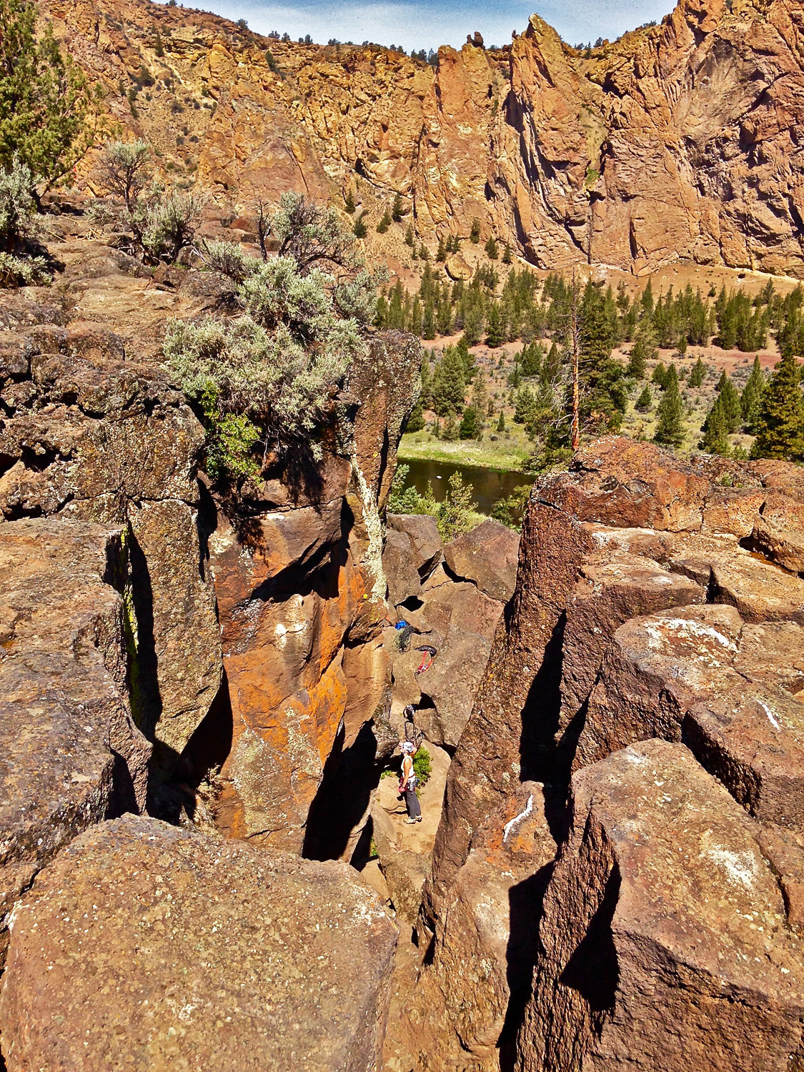 Peering down over the northern most edge you can see climbers on the routes below.