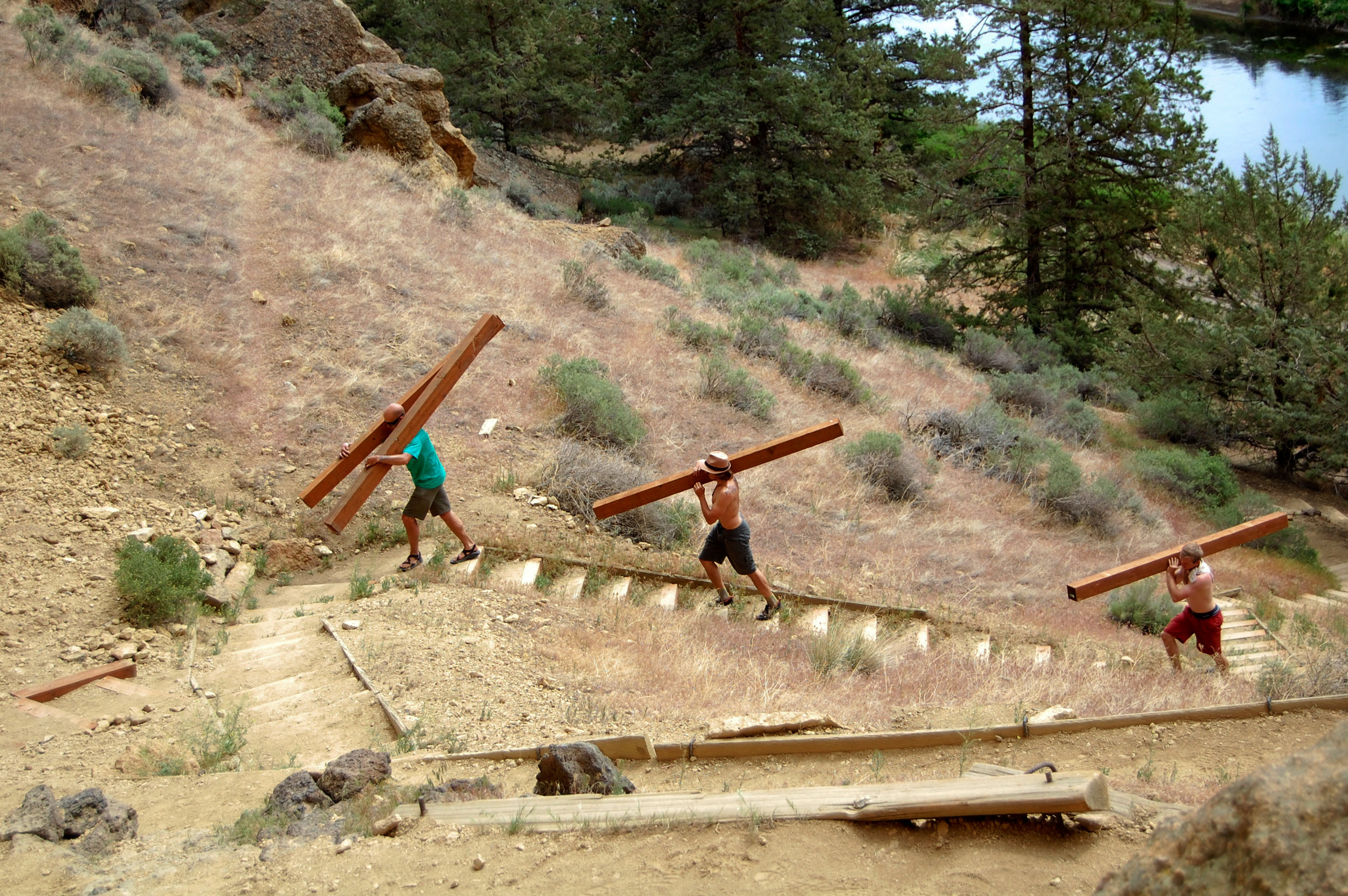 Smith Rock Spring Thing volunteers lug heavy materials up stairs to stabilize trails up even higher