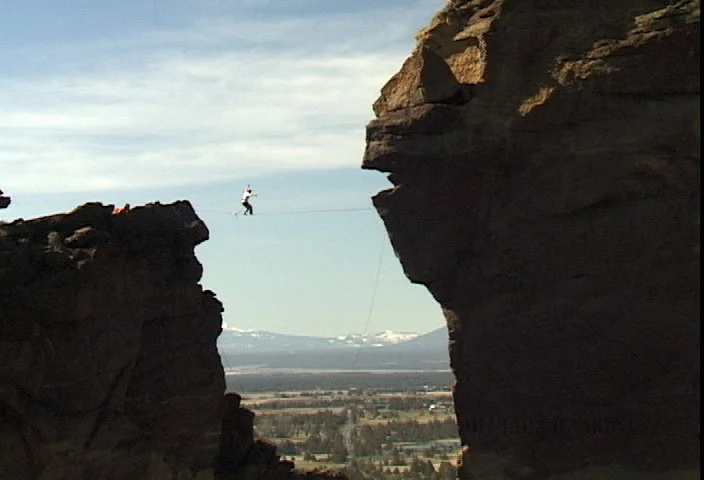 slackliner on Classic Monkey highline at Smith Rock State Park