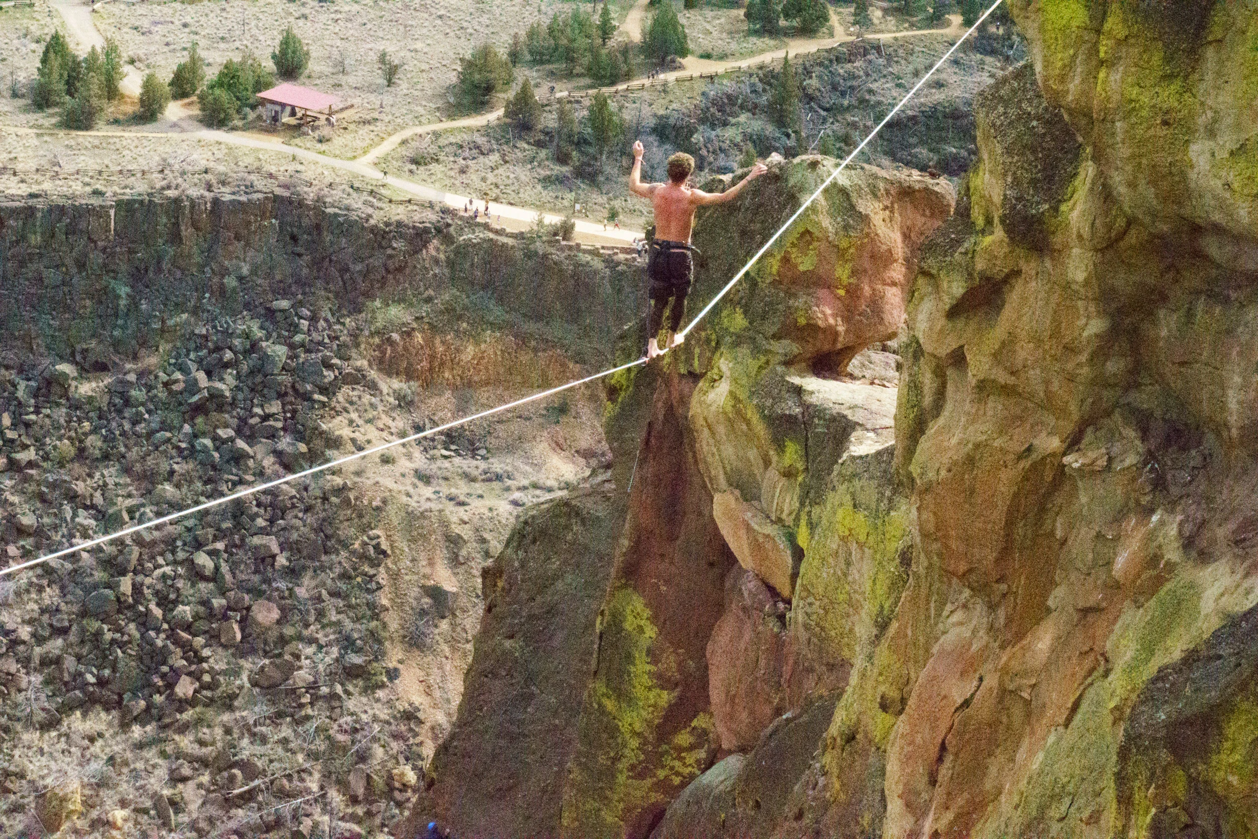 slackliner on Free Your Mind highline at Smith Rock State Park