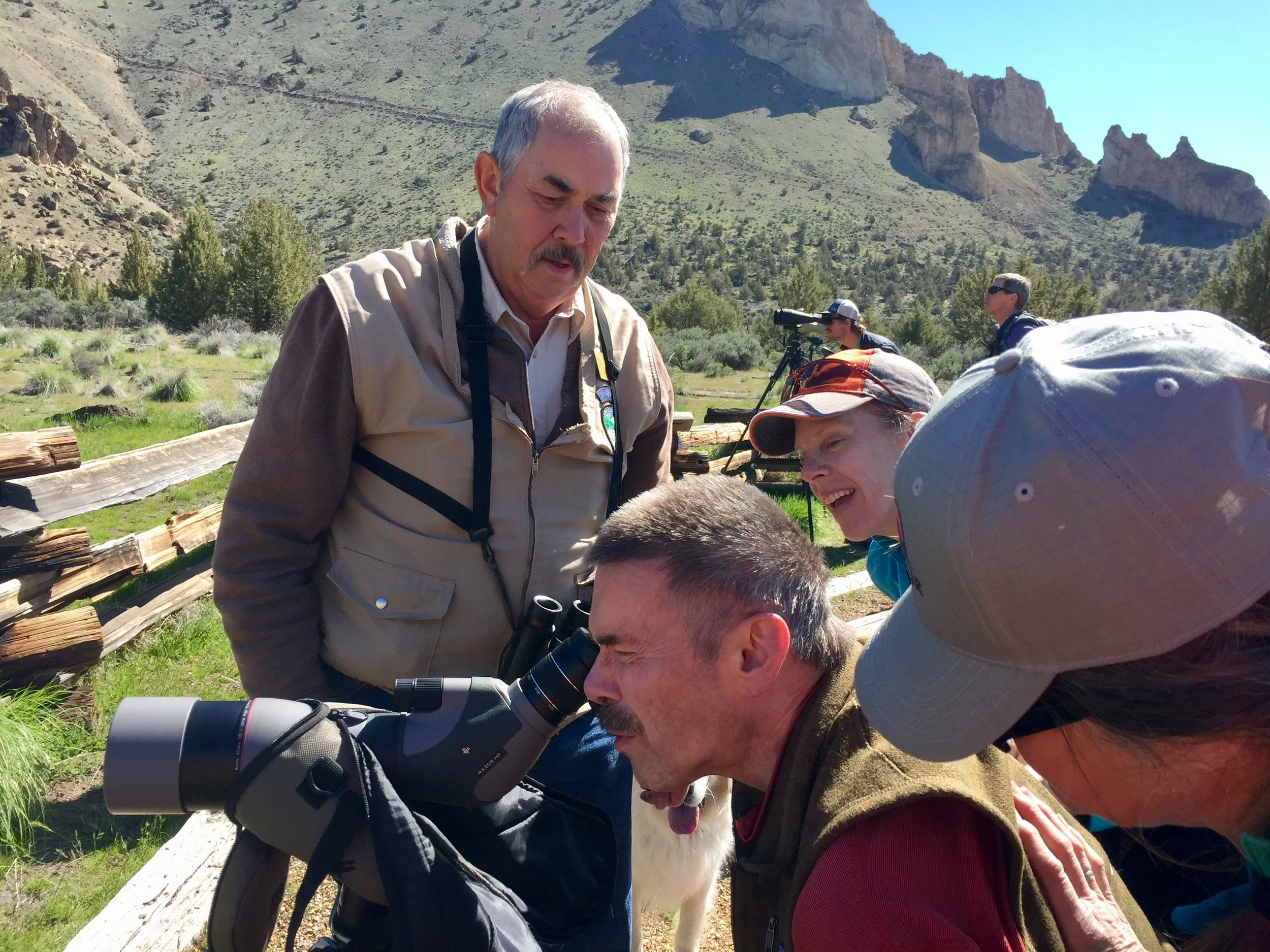 Volunteer Steve Lay sets up the scope for Geoff Babb to see the Golden Eagle nest on April 28, the day Babb is testing his offroad wheelchair (the Advenchair) on the Homestead Trail.