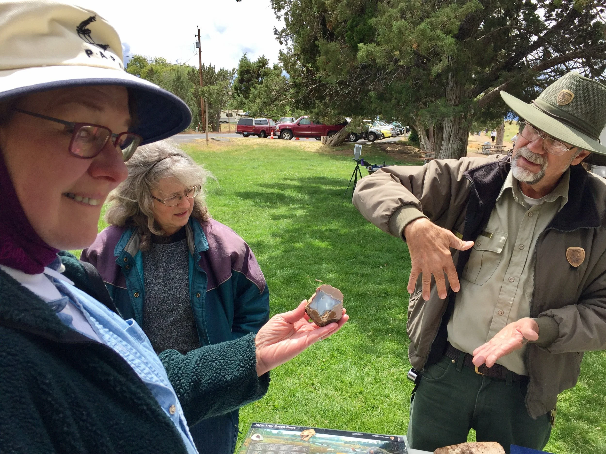 Former Smith Rock State Park Naturalist David Vick talks geology with a couple of painters here to enjoy the annual Smith Rock Paint Out.