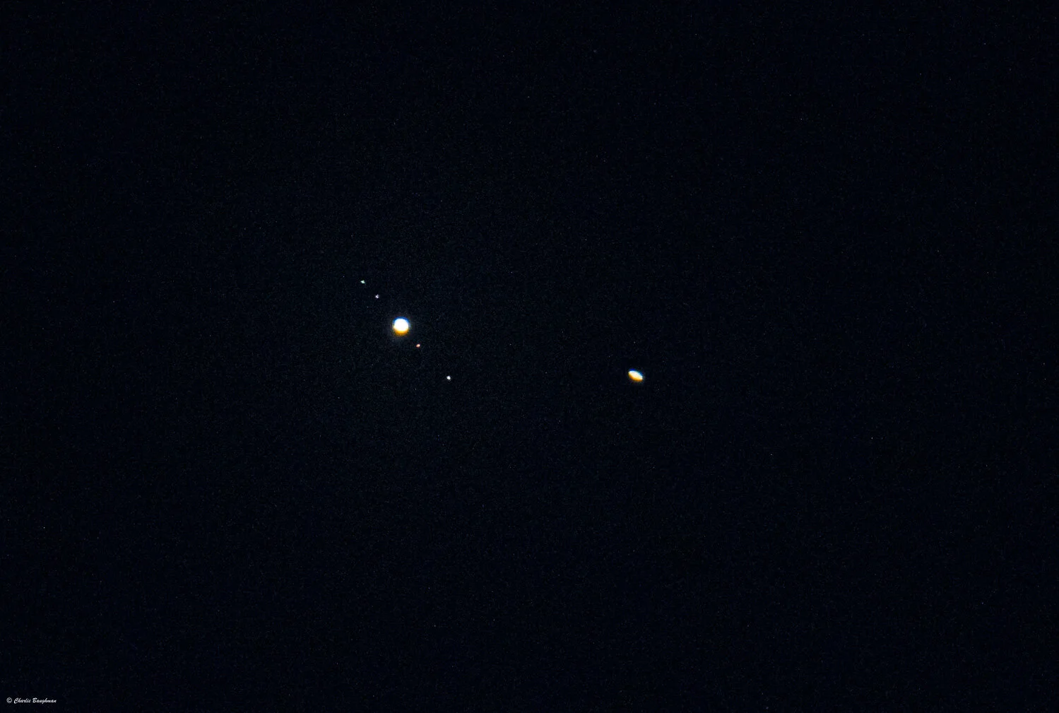 Jupiter with 4 of its moons and Saturn is to the right.