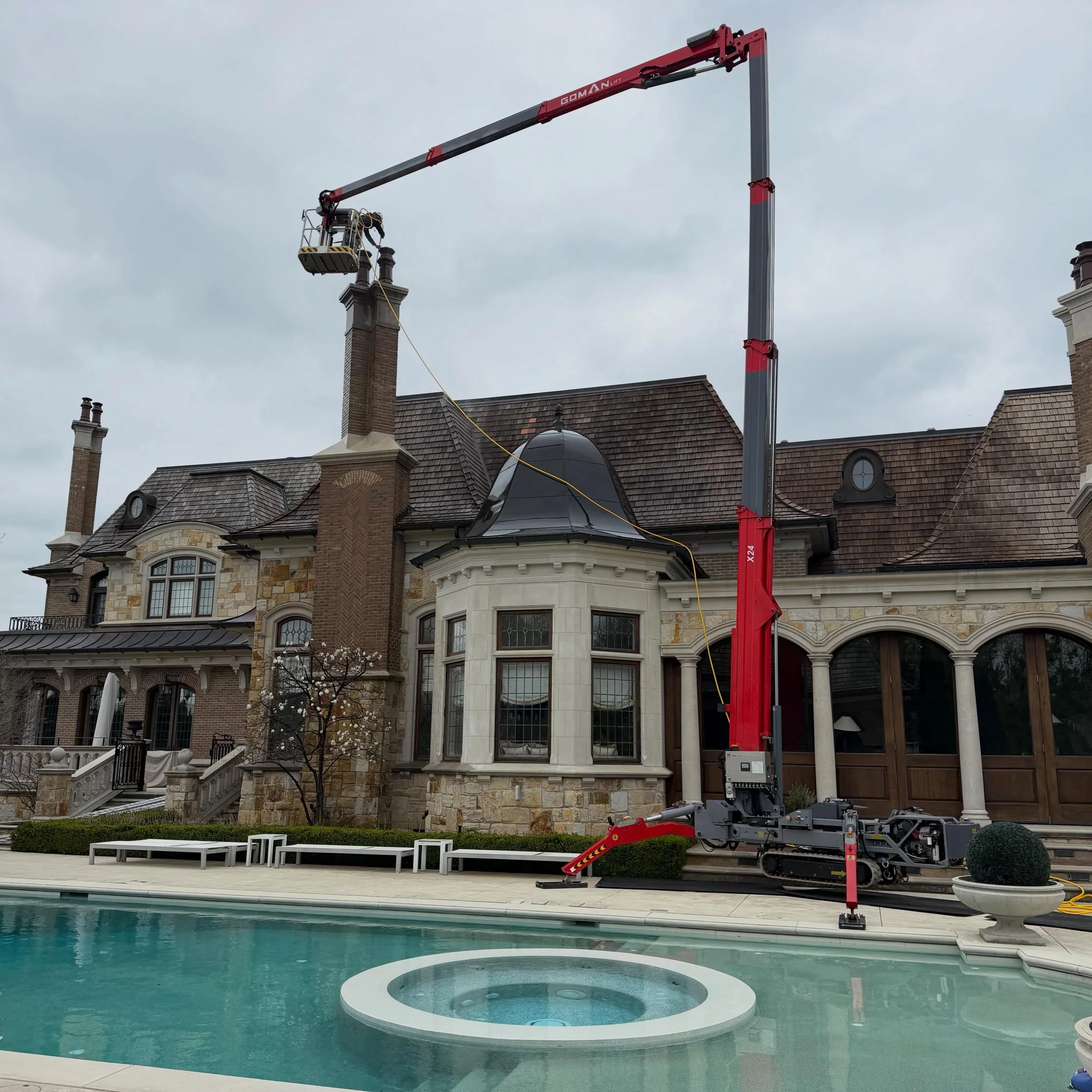 A monster home in Kleinburg where we cleaned their cedar roof and stone chimneys.