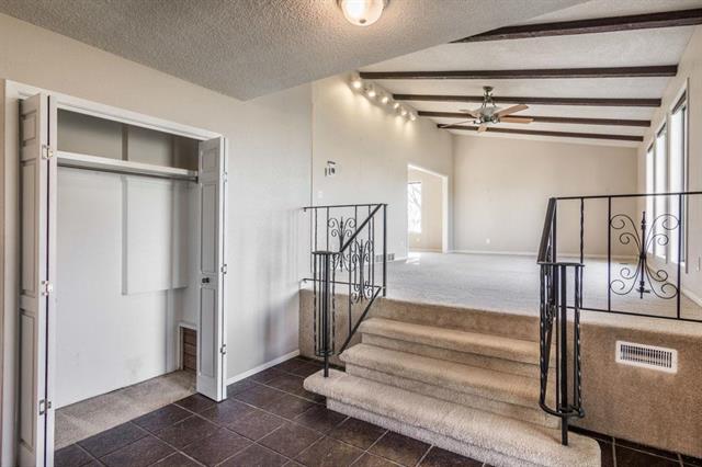 One of my favorite aspects of construction in the midcentury era was all the stairs and levels! This is the view of the living room from the front door.