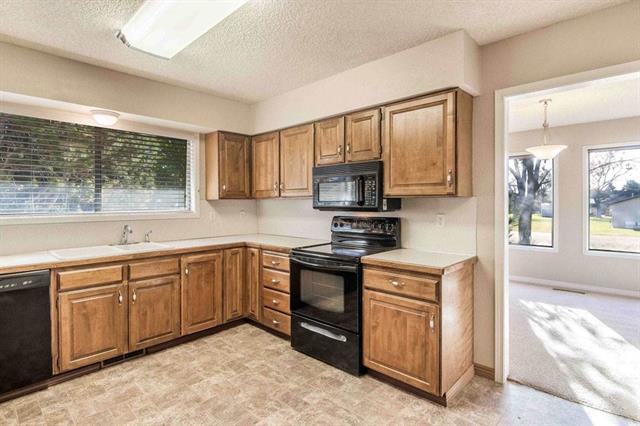 The kitchen was updated (poorly) sometime over the years. It has very little light, lots of dead space, and is incredibly boxed in.