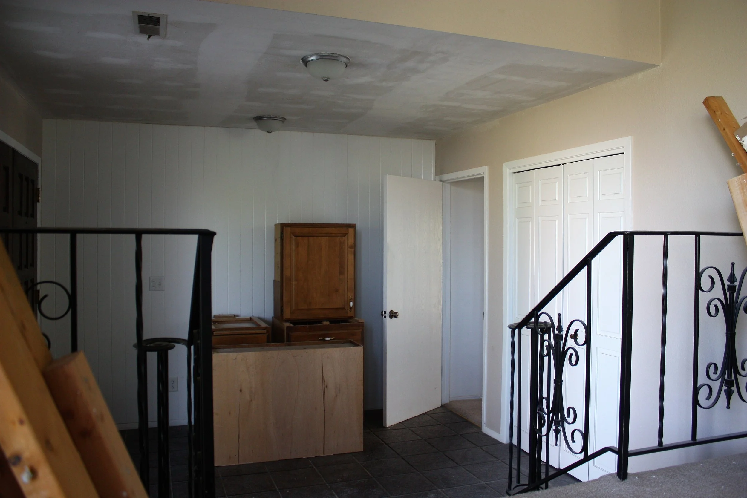 And here is the view of the entryway from the living room. This is one of the spaces I am most looking forward to giving new life to.