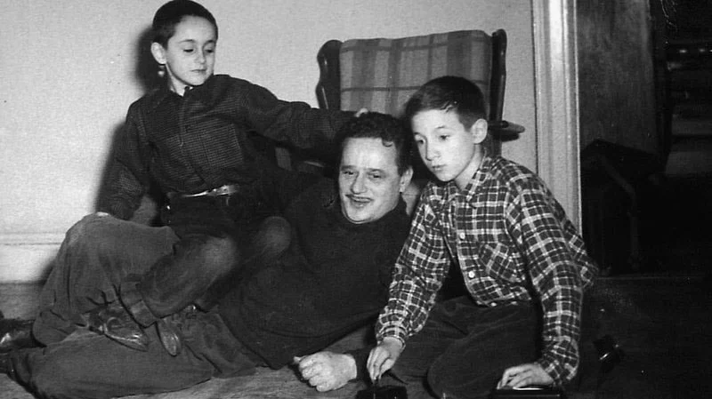 Abel Meeropol watches as his sons, Robert and Michael, play with a train set. Courtesy of Robert and Michael Meeropol
