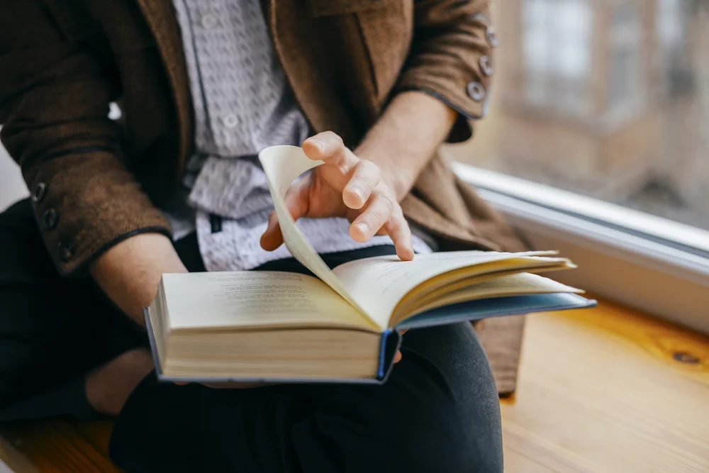 Guy reading book.jpg
