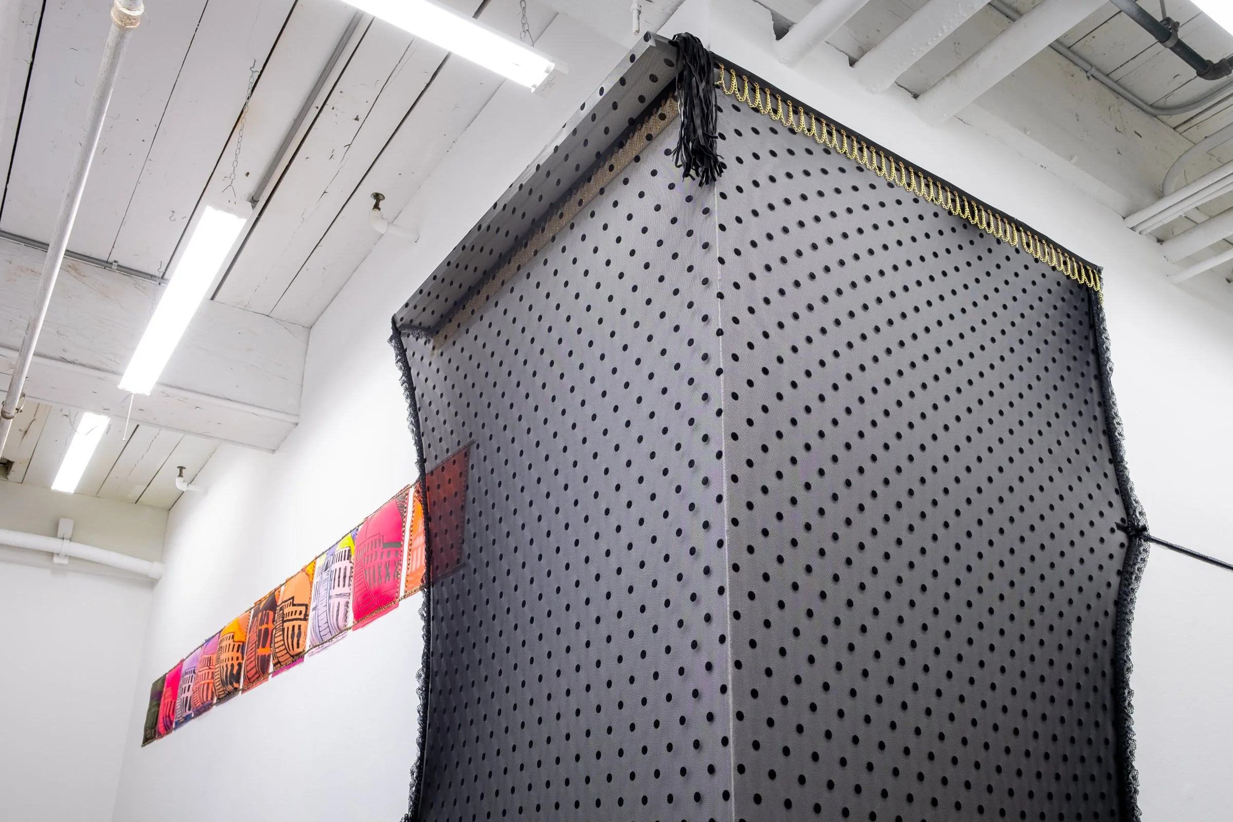  Belle De Jour for Hallway Corner                                         2025. Site-specific installation with spandex mesh, elastic trim, pleather, leather, ceramic, shelves, doorknob                                 152" x 125" x 5" 