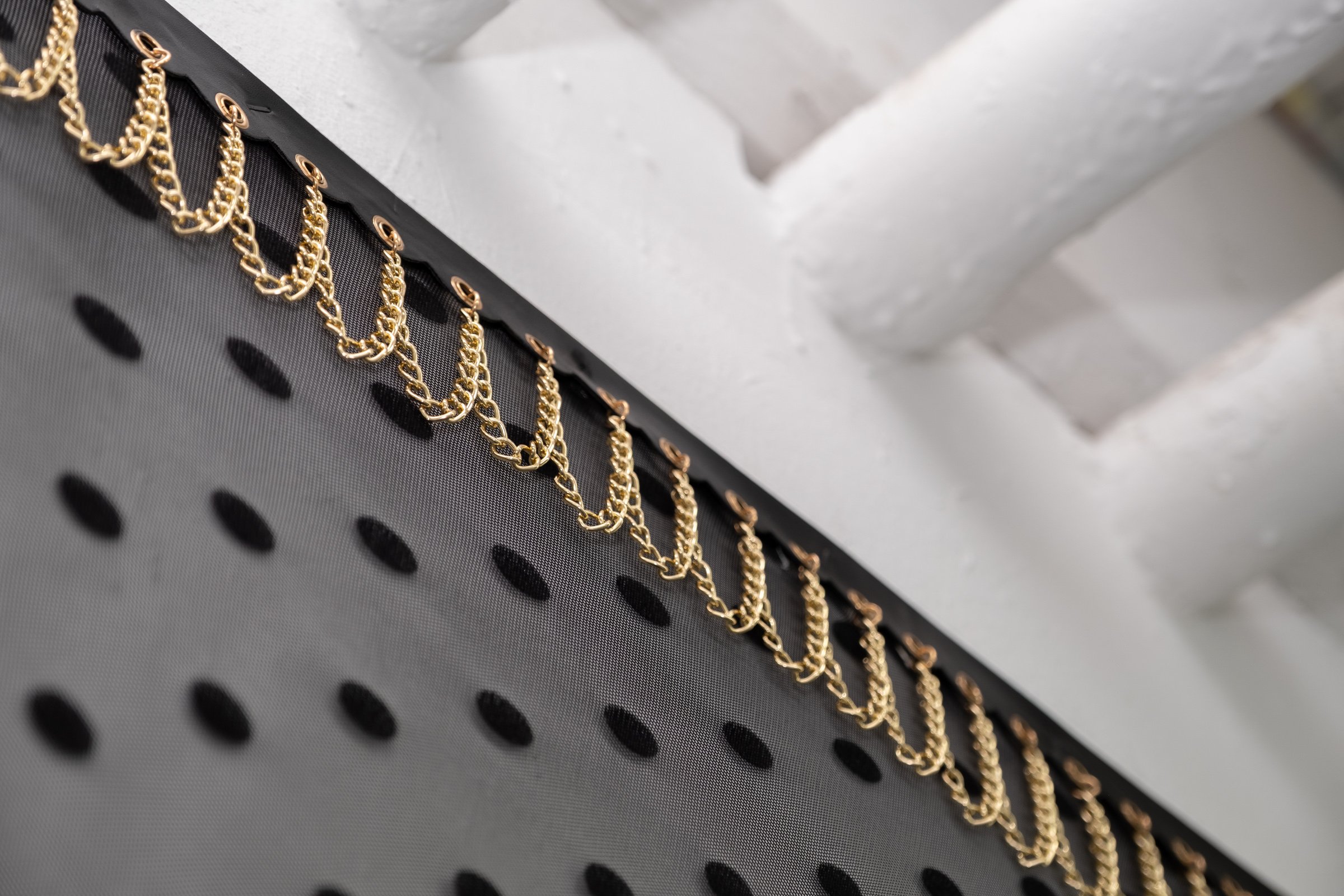   Belle De Jour for Hallway Corner                                         2025. Site-specific installation with spandex mesh, elastic trim, pleather, leather, ceramic, shelves, doorknob                                 152" x 125" x 5" 