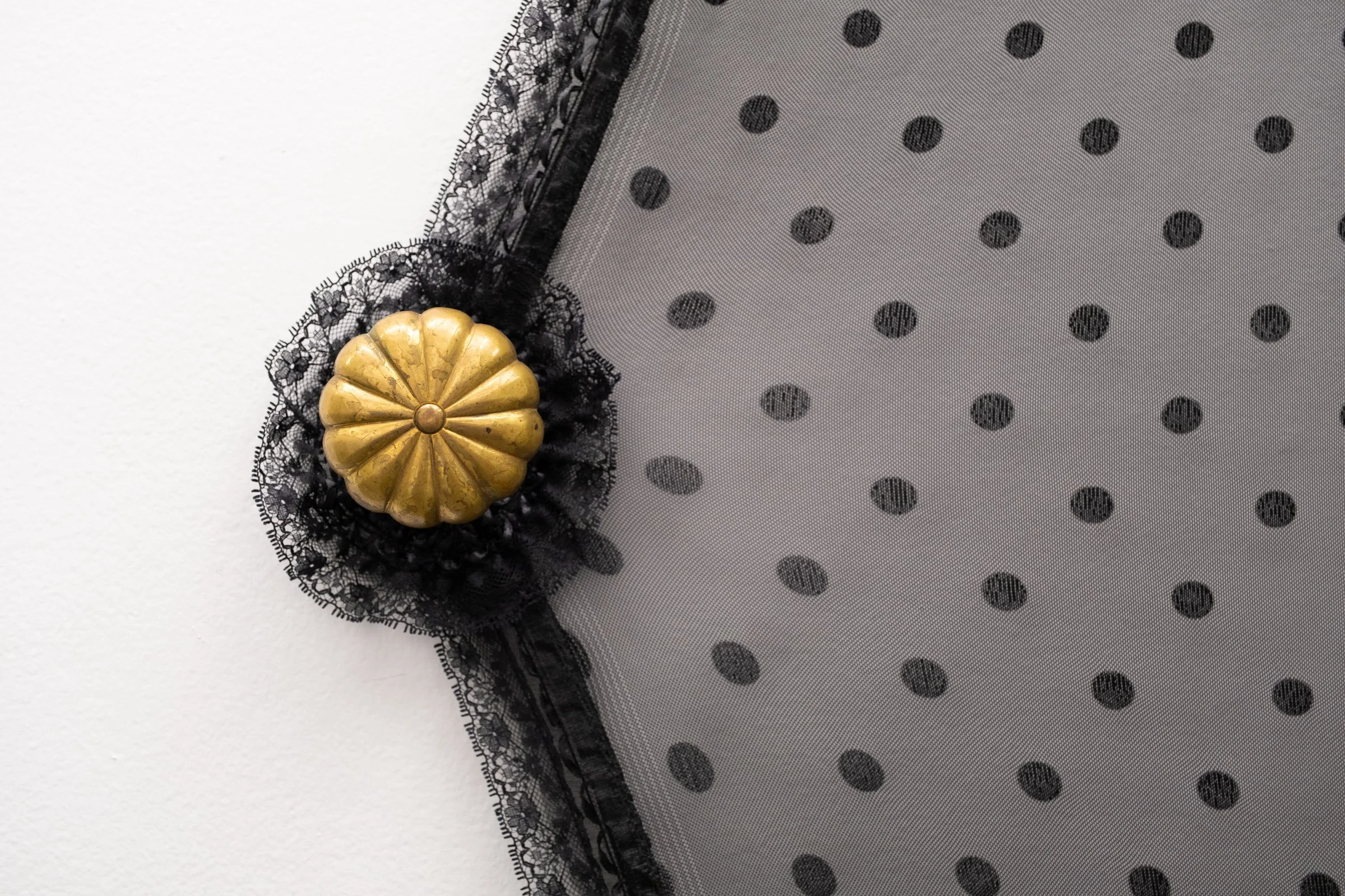   Belle De Jour for Hallway Corner                                         2025. Site-specific installation with spandex mesh, elastic trim, pleather, leather, ceramic, shelves, doorknob                                 152" x 125" x 5" 