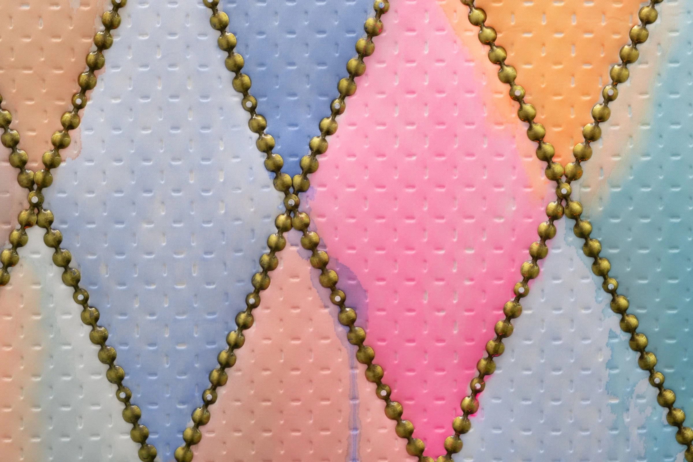   128 (for OyG)                                               2025. Site-specific painting with neoprene, fluid acrylic, batting, upholstery tacks, nails            40.5" x 87.5" x 5" 
