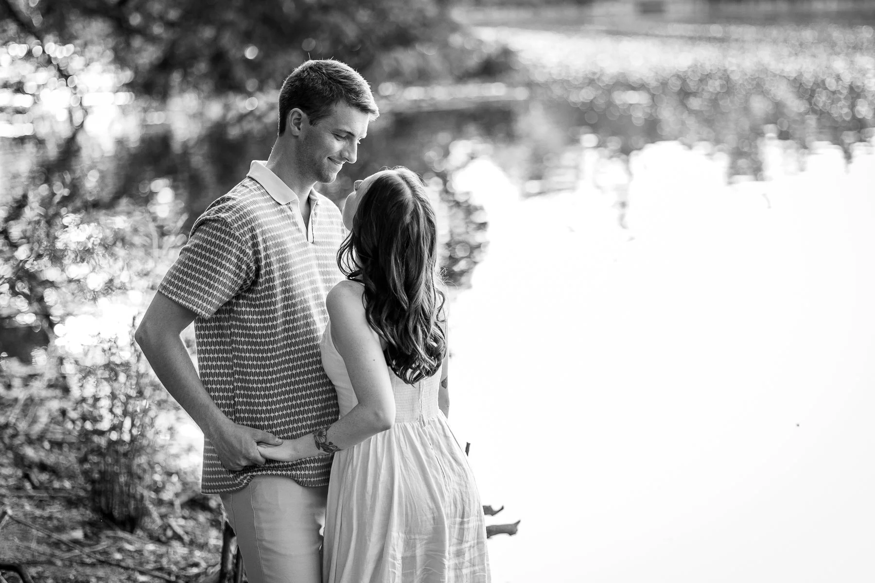 couple looking at each other by lake