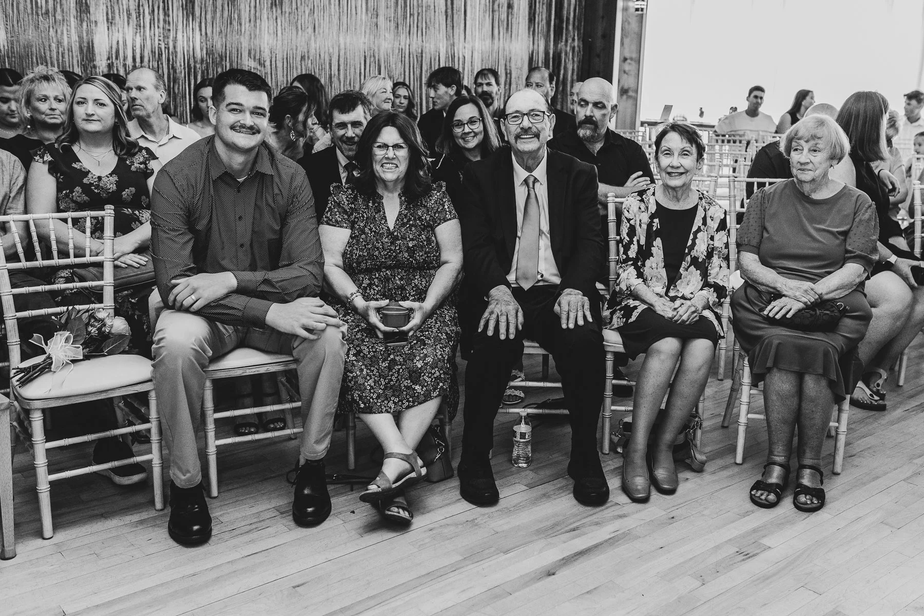 wedding guests sitting in front row
