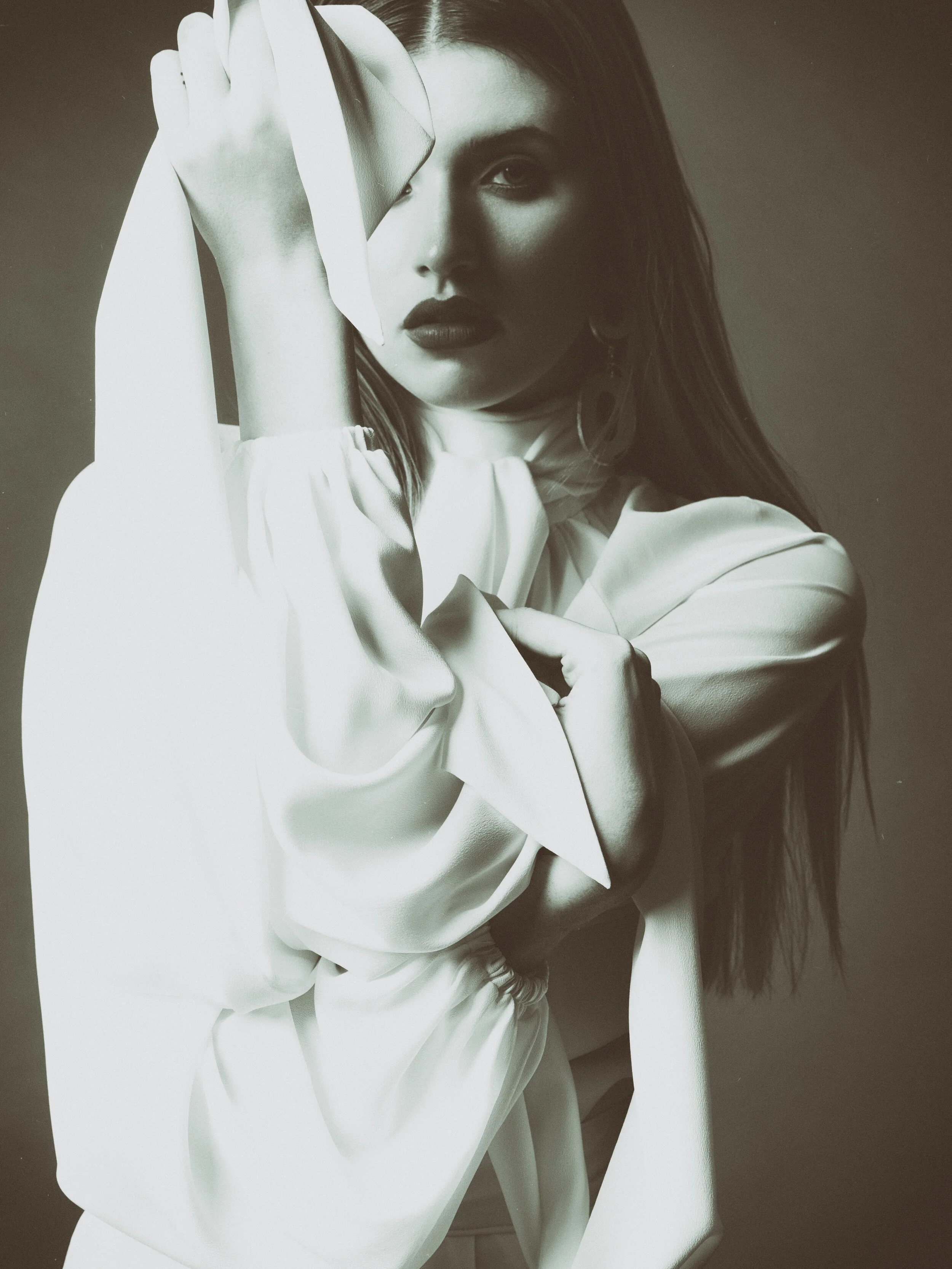  New York editorial styling featuring moody black and white close-up of woman shot on film 