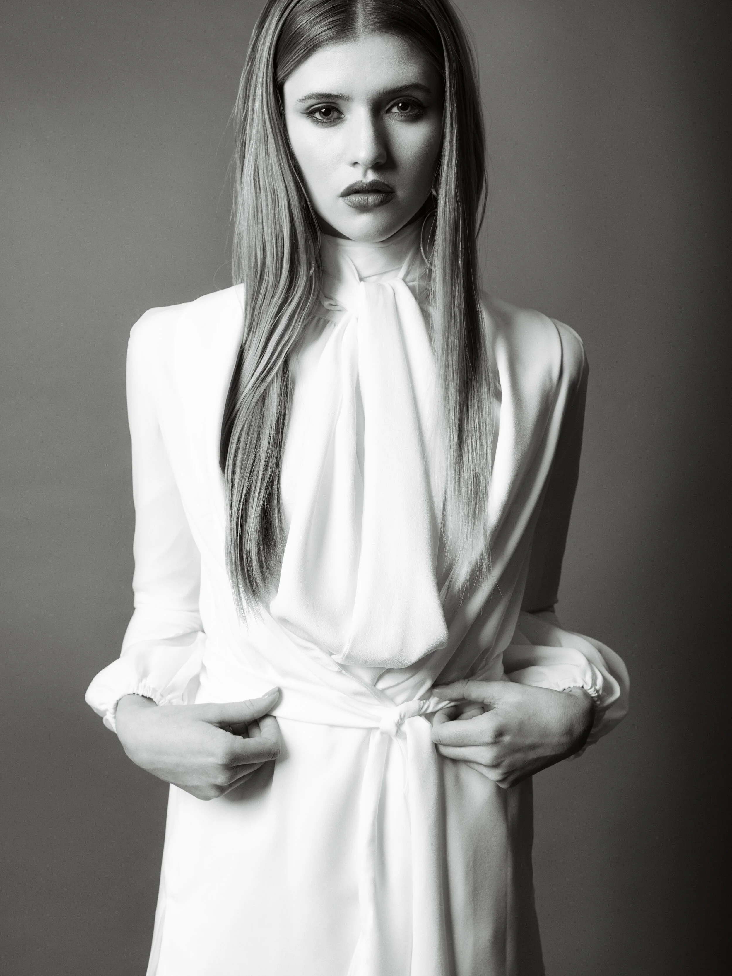 St. Paul editorial styling featuring black and white photo of woman in white outfit with long hair 