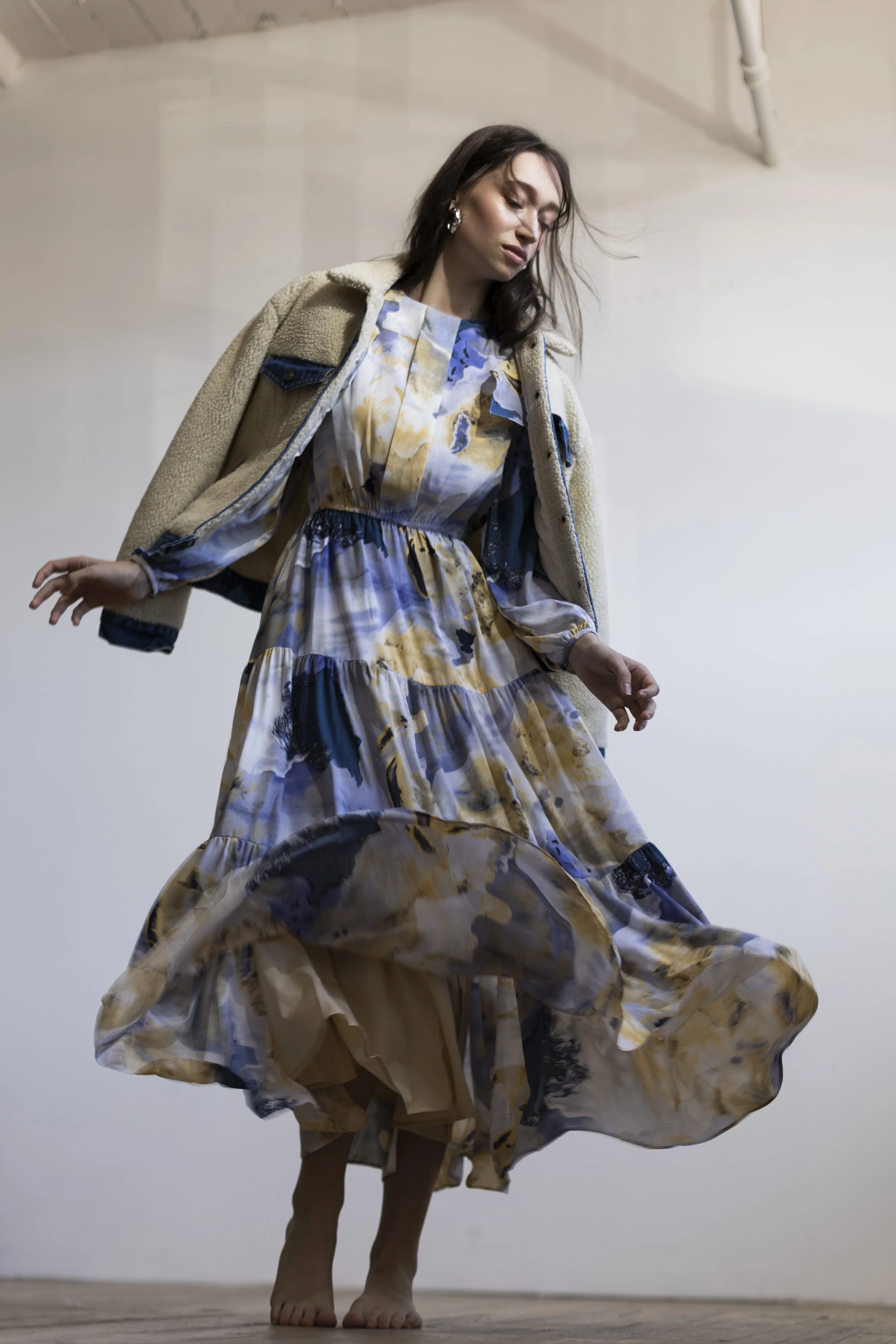  Minneapolis wardrobe stylist and personal stylist Kate Moroney featuring model in sherpa-lined denim jacket and floral dress with soft, layered styling 