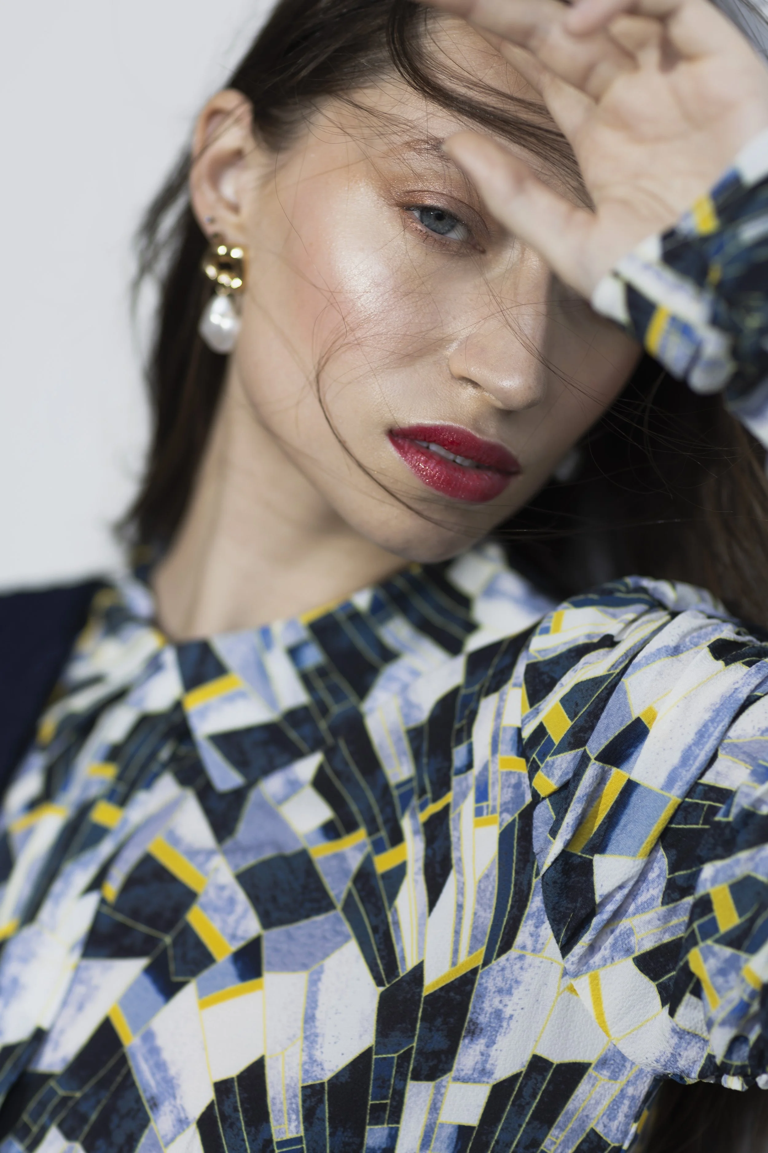  Twin Cities personal stylist featuring close-up of model in floral dress with subtle makeup and soft, modern styling 
