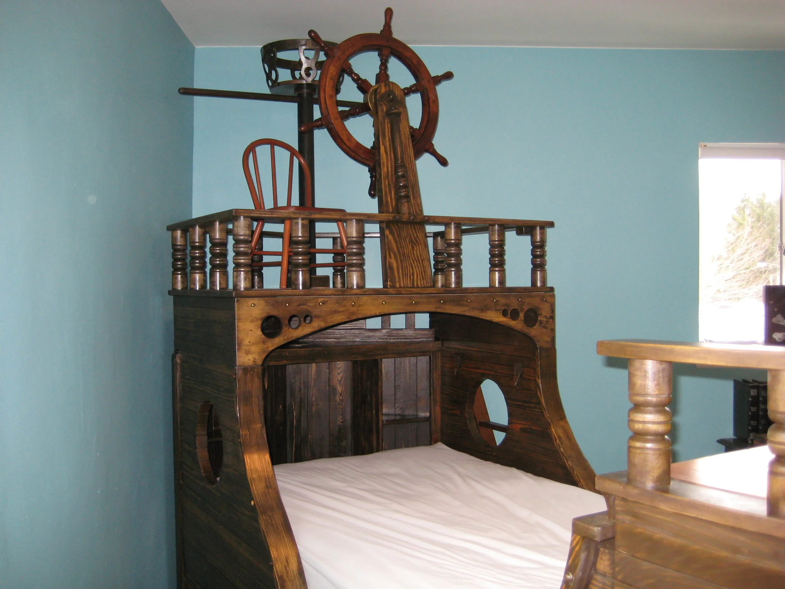 A pirate ship theme child's bed.