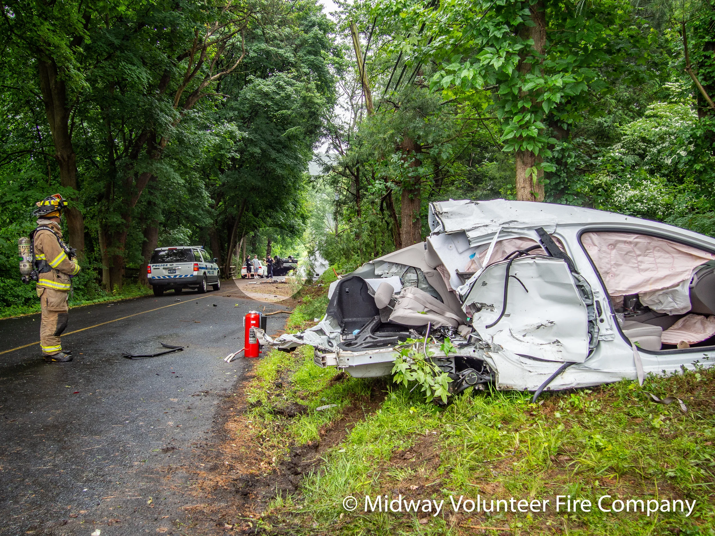 2019.06.10 - Rescue 5 and Engine 15 respond to a two vehicle accident on Holicong Road at Upper Mountain road. Three people transported to area hospitals after being extracted. The accident involved the white vehicle in the foreground and the overturned truck in the highlight circle. The other white car was not involved.