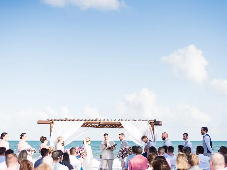 stunning destination wedding facing the caribbean ocean in cancun mexico.